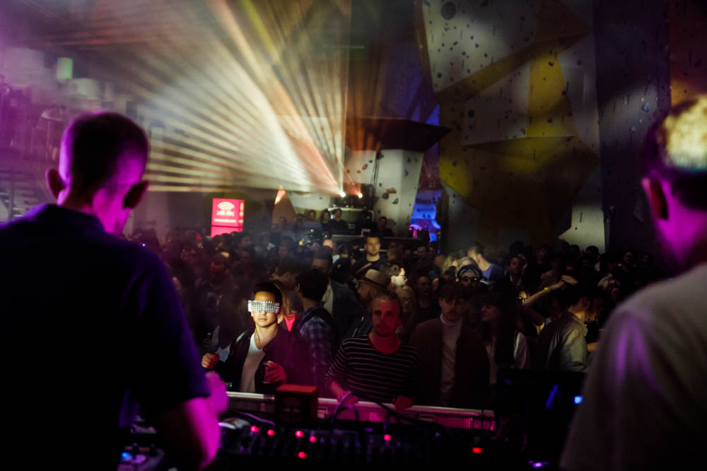 A spectator with funky glasses watches Kenton Slash Demon play. Red Bull Music Academy stage - Distortion Ø