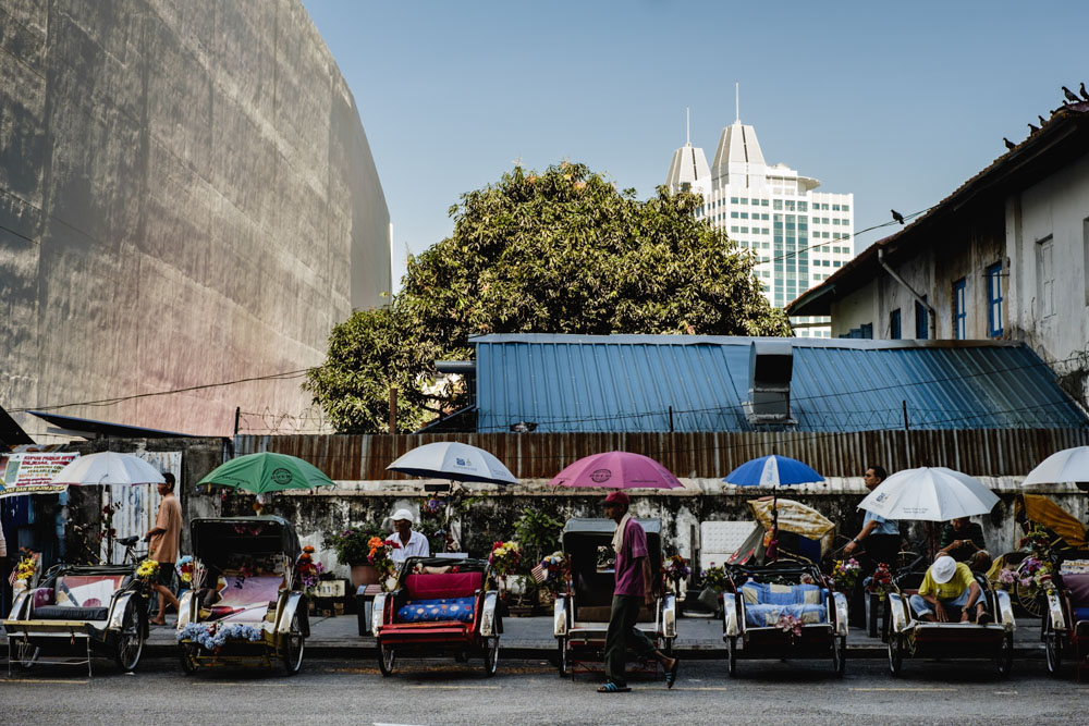 Trishaw riders gather to rest in Jalan Penang. Georgetown, Penang, Malaysia.