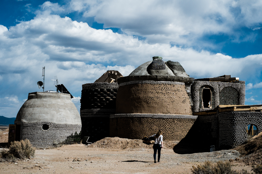 Earthship: http://earthship.com/Designs/earthship-village-ecologies